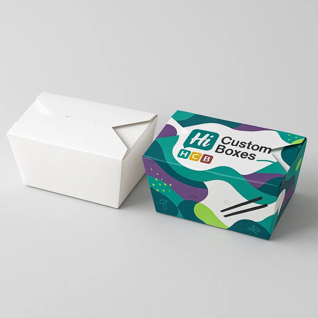 Closed rectangular cardboard takeaway boxes- one plain white and one with vibrant- abstract multi-coloured patterns- class=